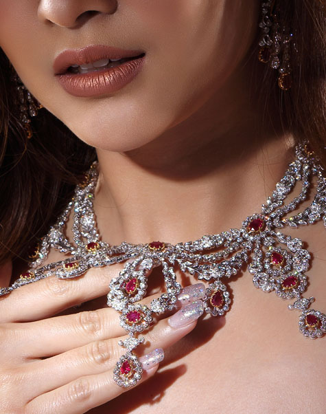 Luxury diamond and ruby necklace with matching manicure