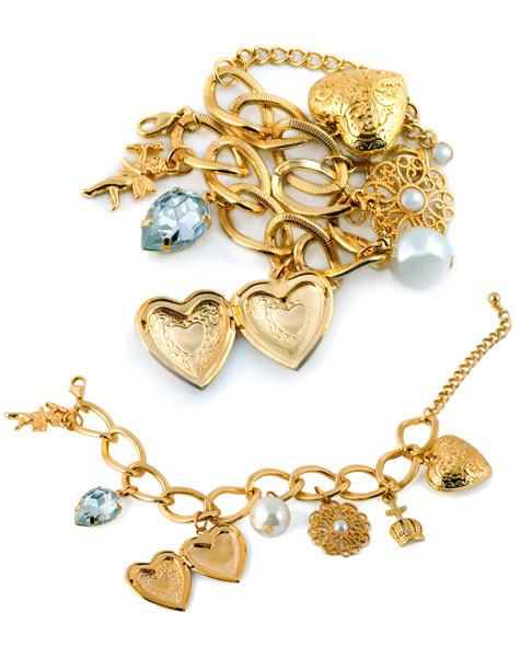 Gold charm bracelets with heart lockets and gemstone accents